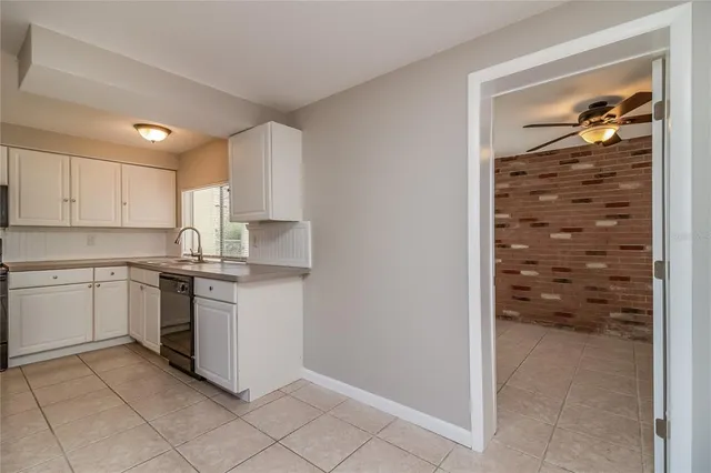 a kitchen with granite countertop cabinets and appliances
