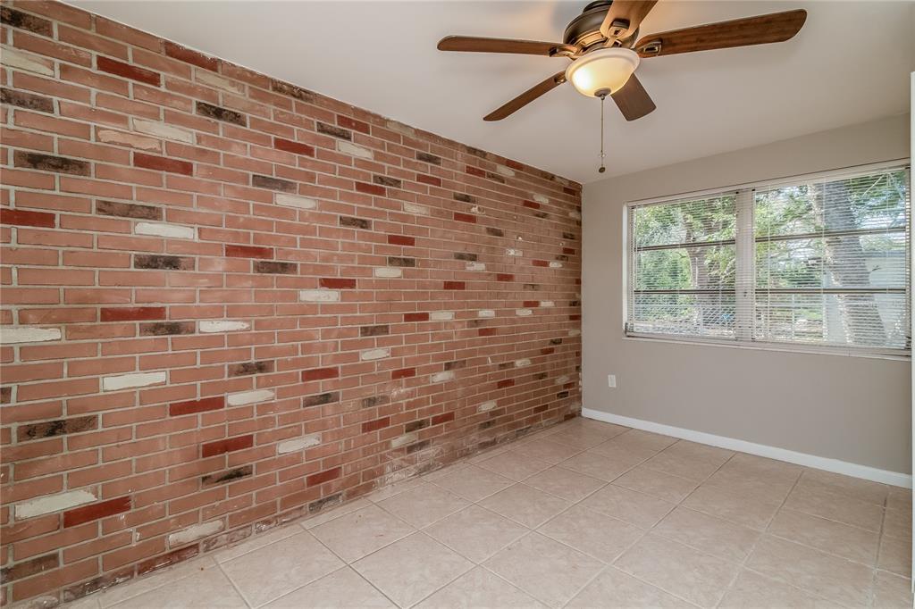 3824 Moog Road Holiday, FL 34691 - Photo 10 of 16 a view of empty room with ceiling fan