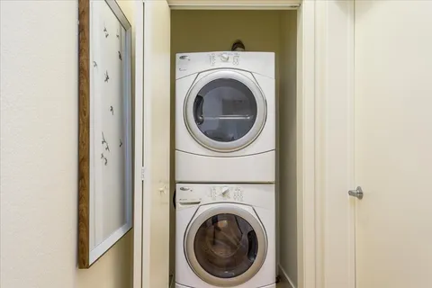 a view of a hallway with washer and dryer