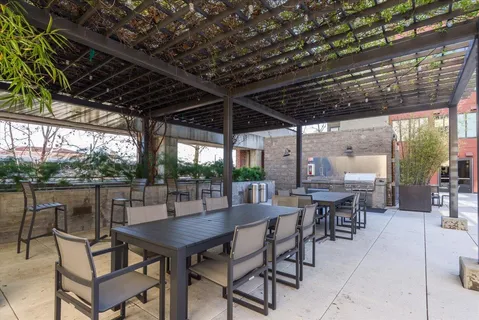 a view of a dinning table and chairs in the patio