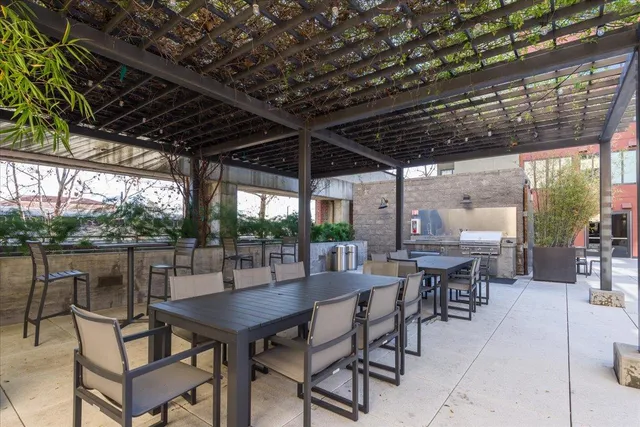 a view of a dinning table and chairs in the patio