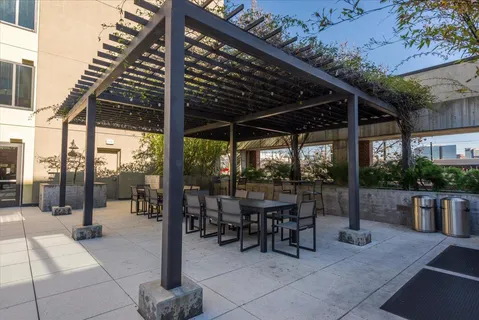 a patio with table and chairs