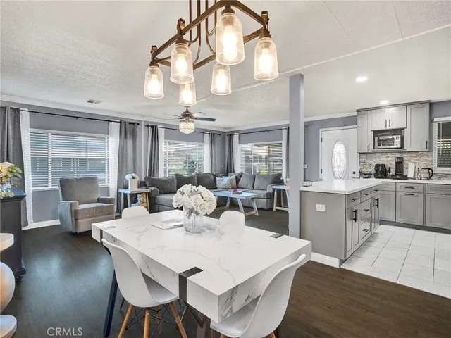 a large kitchen with a table and chairs