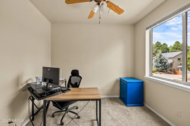 a view of a workspace with furniture