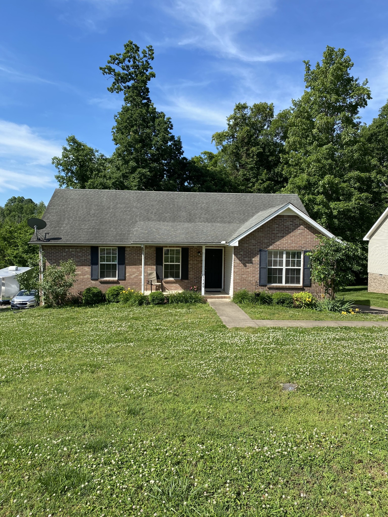 a front view of a house with a yard