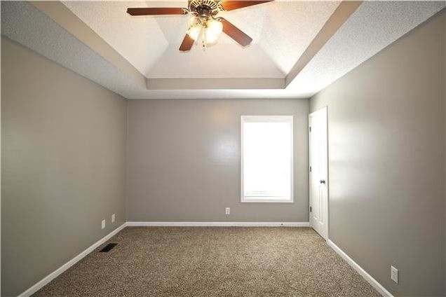 1740 Hazelwood Road Clarksville, TN 37040 - Photo 11 of 20 an empty room with a window and a fan