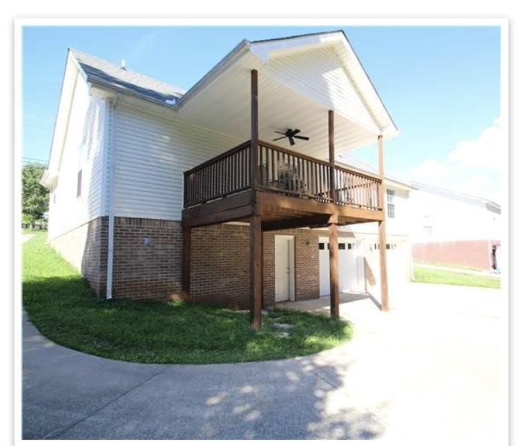 1740 Hazelwood Road Clarksville, TN 37040 - Photo 19 of 20 a view of a house with a small yard
