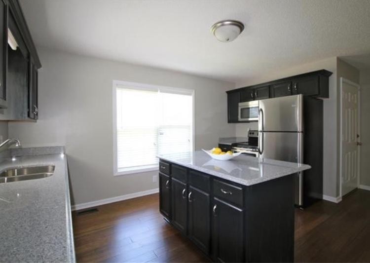 1740 Hazelwood Road Clarksville, TN 37040 - Photo 7 of 20 a kitchen with stainless steel appliances granite countertop a refrigerator a sink dishwasher a stove and a refrigerator