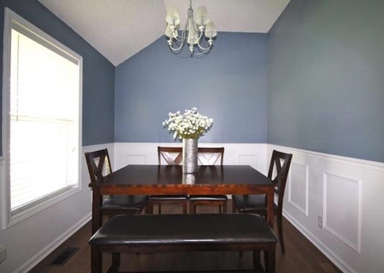 1740 Hazelwood Road Clarksville, TN 37040 - Photo 8 of 20 a view of a dining room with furniture a chandelier and wooden floor