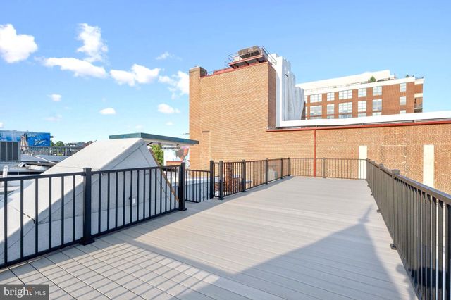 a view of balcony with wooden floor