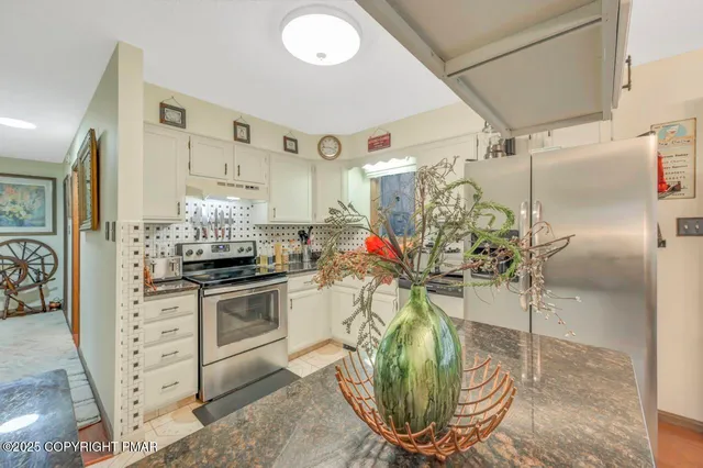 a view of a kitchen with appliances