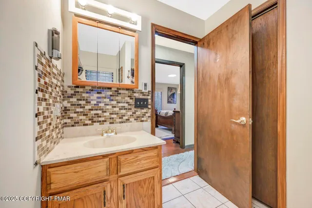 a bathroom with a bathtub and a sink