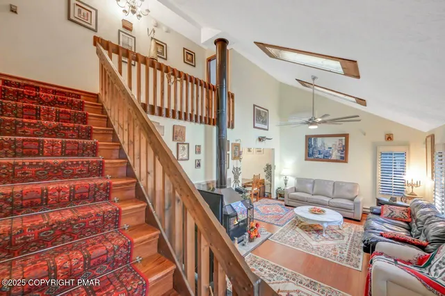 a living room with furniture or stairs and a wooden floor