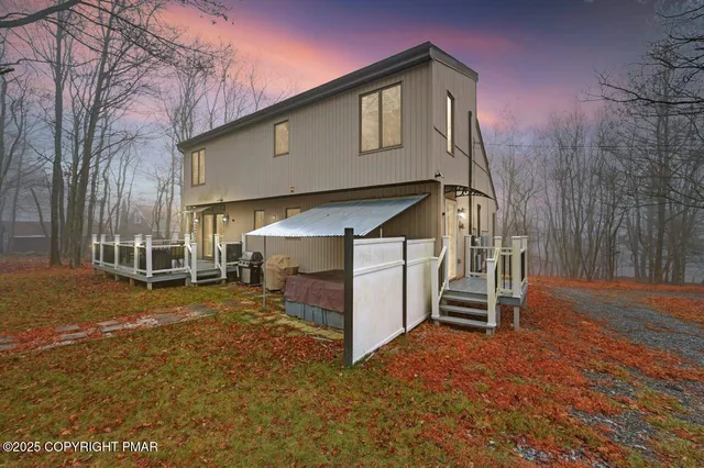 a view of a house with a yard and garage