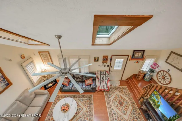 a view of an entryway with wooden floor