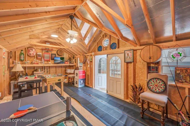 a view of a house with a yard covered in snow