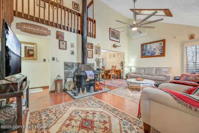 a living room with furniture and a rug