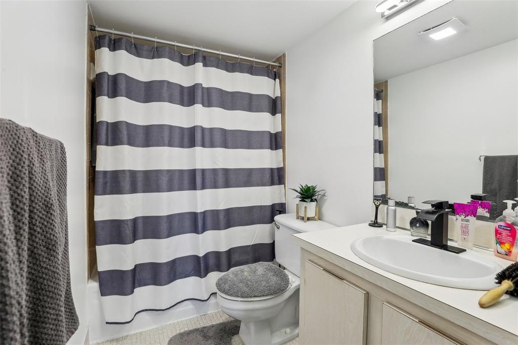 5570 Northwest 44th Street, Unit 510A Lauderhill, FL 33319 - Photo 11 of 25 a bathroom with a sink toilet and shower