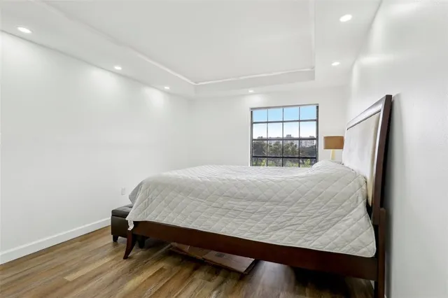 a room with a bed and a window