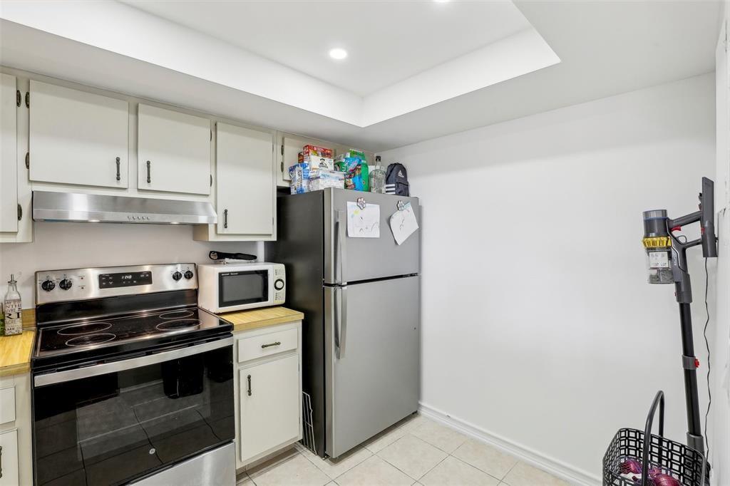 5570 Northwest 44th Street, Unit 510A Lauderhill, FL 33319 - Photo 19 of 25 a kitchen with a refrigerator and a stove top oven