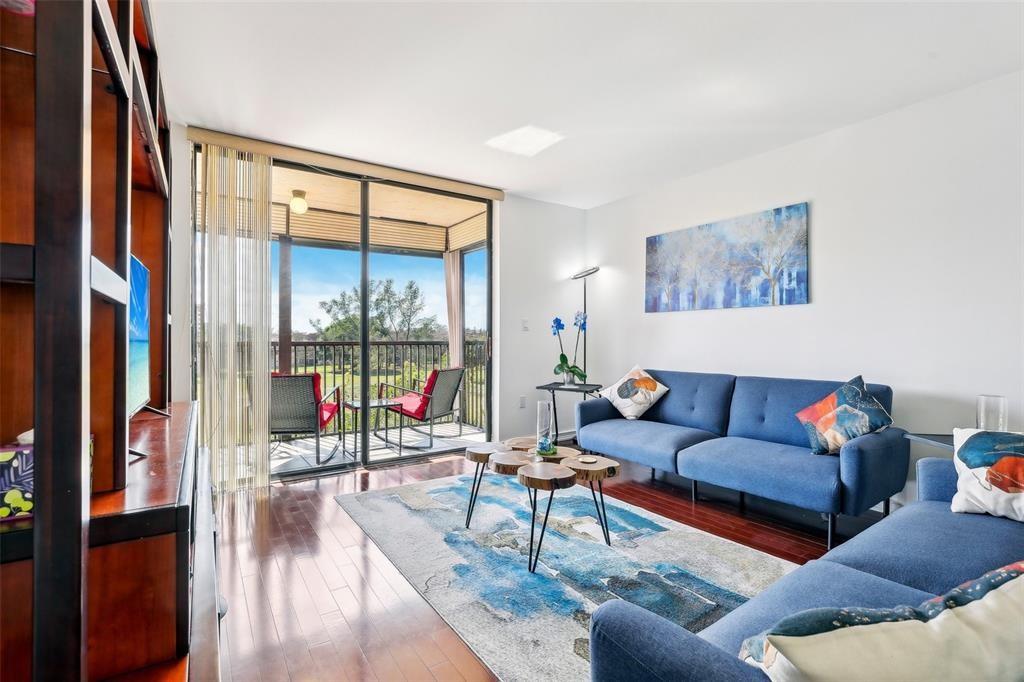 5570 Northwest 44th Street, Unit 510A Lauderhill, FL 33319 - Photo 25 of 25 a living room with furniture and a large window