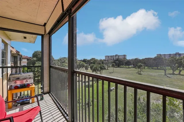 a view of balcony with furniture