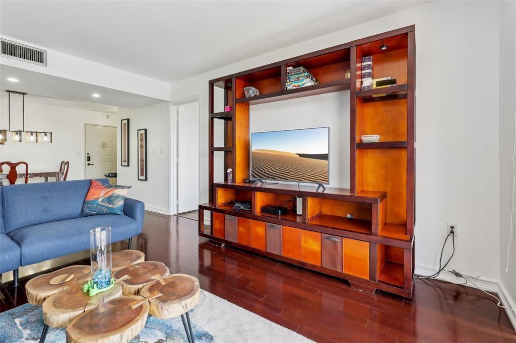 5570 Northwest 44th Street, Unit 510A Lauderhill, FL 33319 - Photo 5 of 25 a living room with furniture and a flat screen tv