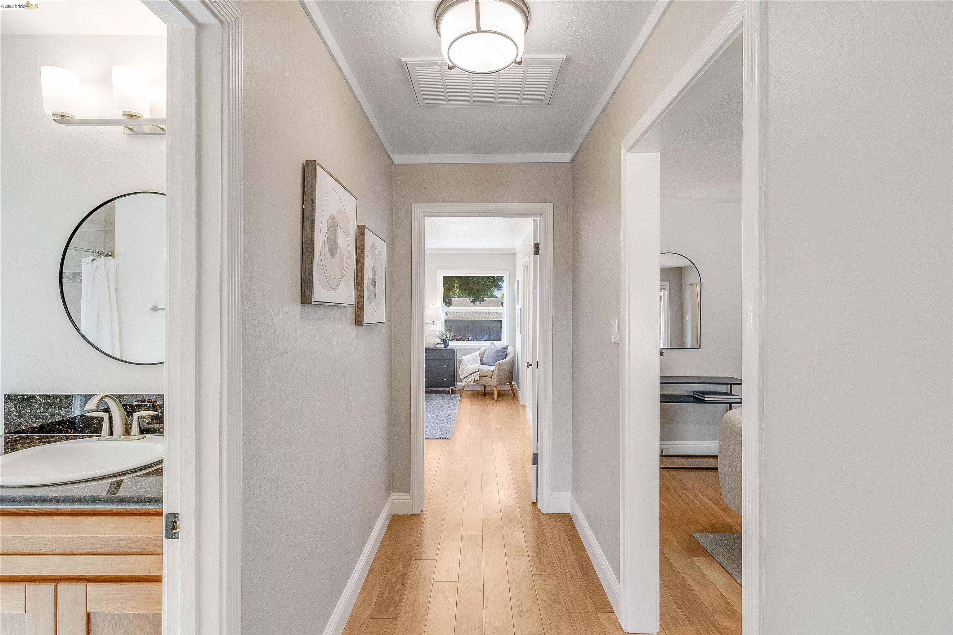 346 Valley View Road Pleasant Hill, CA 94523 - Photo 20 of 57 Hallway featuring light wood-finish flooring, light grey wall paint, and white trim