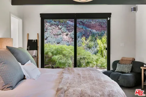 a bath tub sitting next to a window