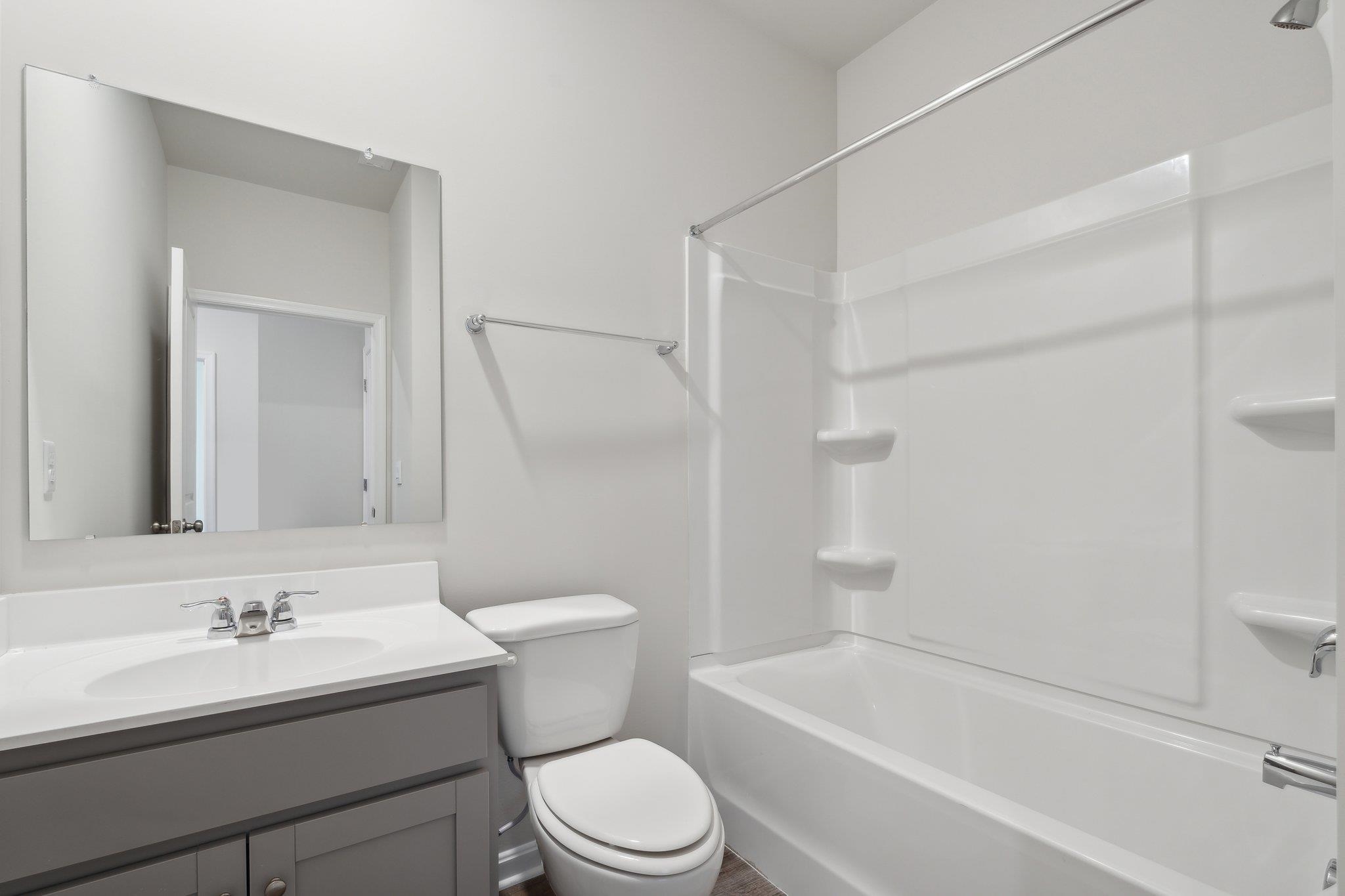 125 Jillian Lane Penn Laird, VA 22846 - Photo 6 of 22 a bathroom with a sink a toilet and shower