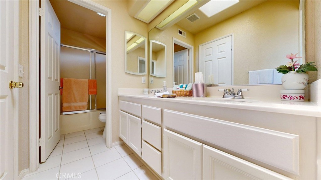 794 Banyonwood Drive Oceanside, CA 92057 - Photo 36 of 62 a bathroom with a sink and a mirror
