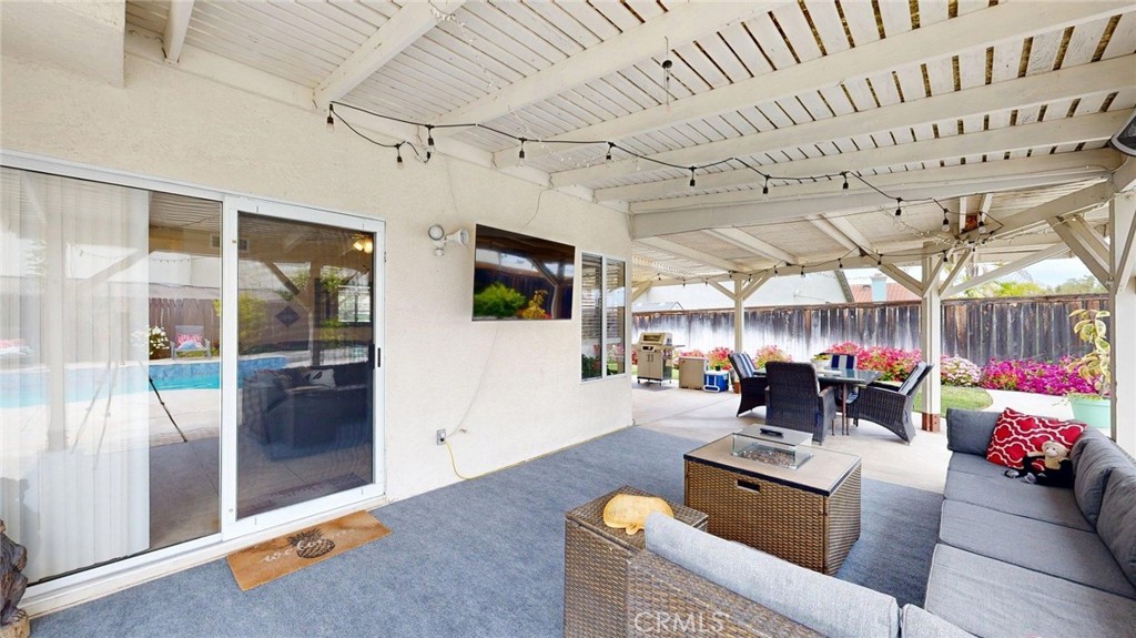 794 Banyonwood Drive Oceanside, CA 92057 - Photo 48 of 62 a living room with furniture and a flat screen tv
