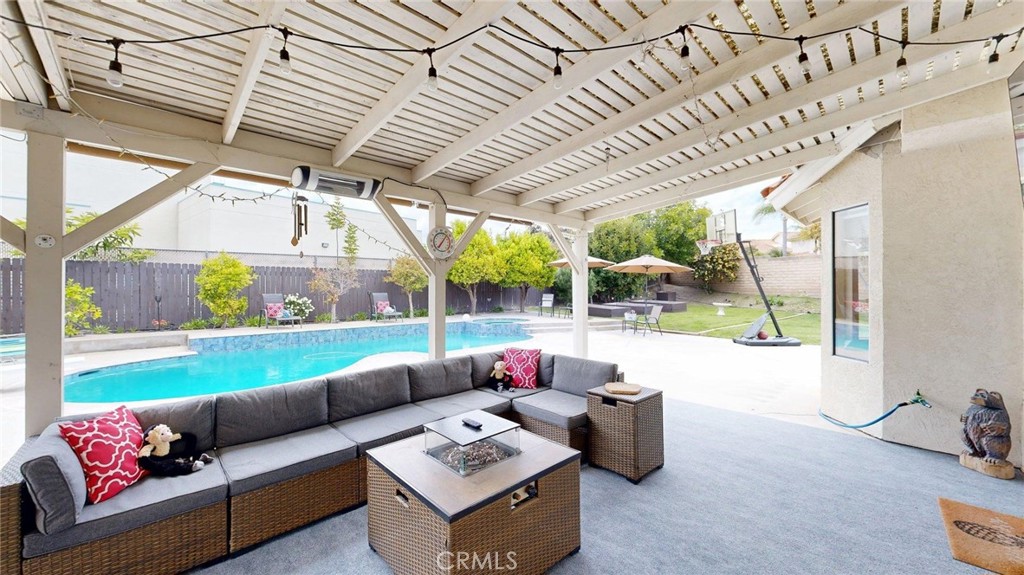 794 Banyonwood Drive Oceanside, CA 92057 - Photo 49 of 62 a living room with patio furniture and a garden