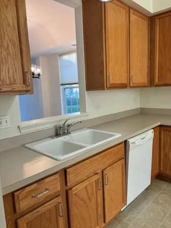 a kitchen with stainless steel appliances granite countertop a sink and cabinets