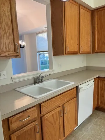 a kitchen with stainless steel appliances granite countertop a sink and cabinets