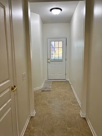 a view of entryway with bathroom