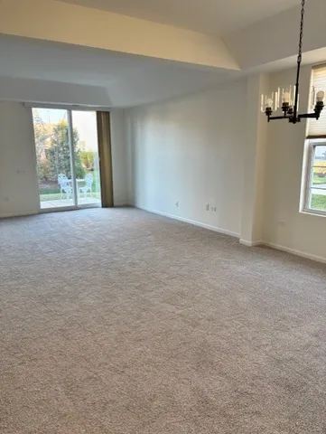 a view of empty room with floor to ceiling window