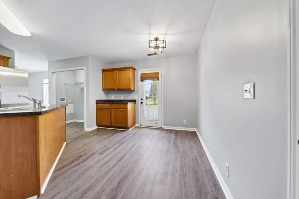 a bathroom with a sink vanity and a mirror