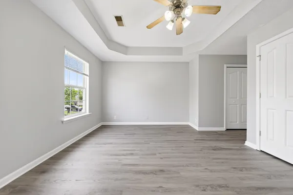 a view of an entryway with wooden floor