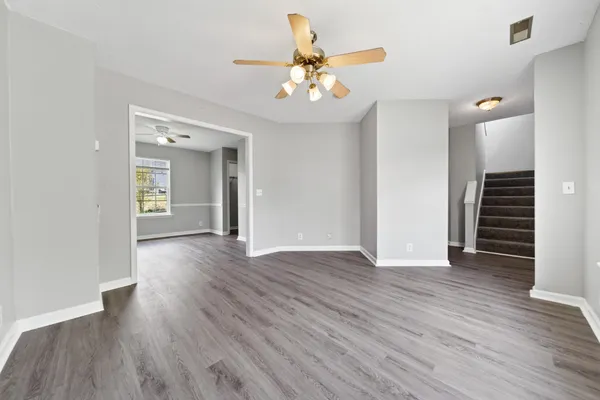 a kitchen with stainless steel appliances granite countertop a stove microwave and refrigerator