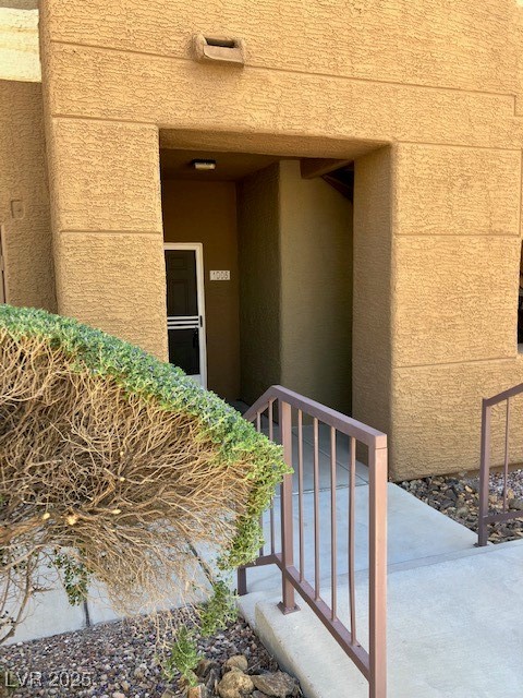8070 West Russell Road, Unit 1005 Las Vegas, NV 89113 - Photo 1 of 12 Property entrance with stucco siding
