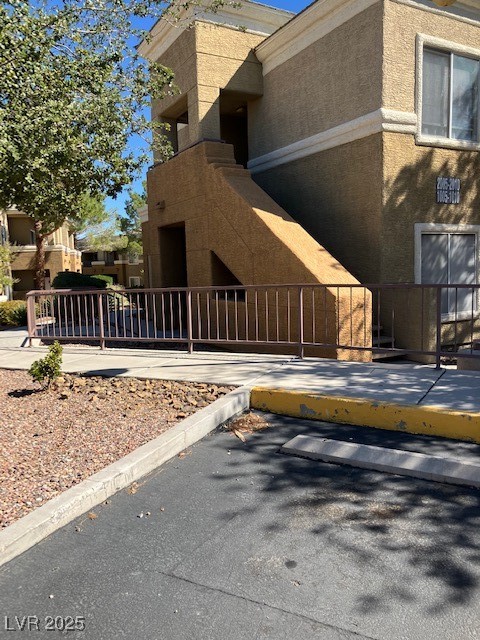 8070 West Russell Road, Unit 1005 Las Vegas, NV 89113 - Photo 2 of 12 View of side of property with stucco siding