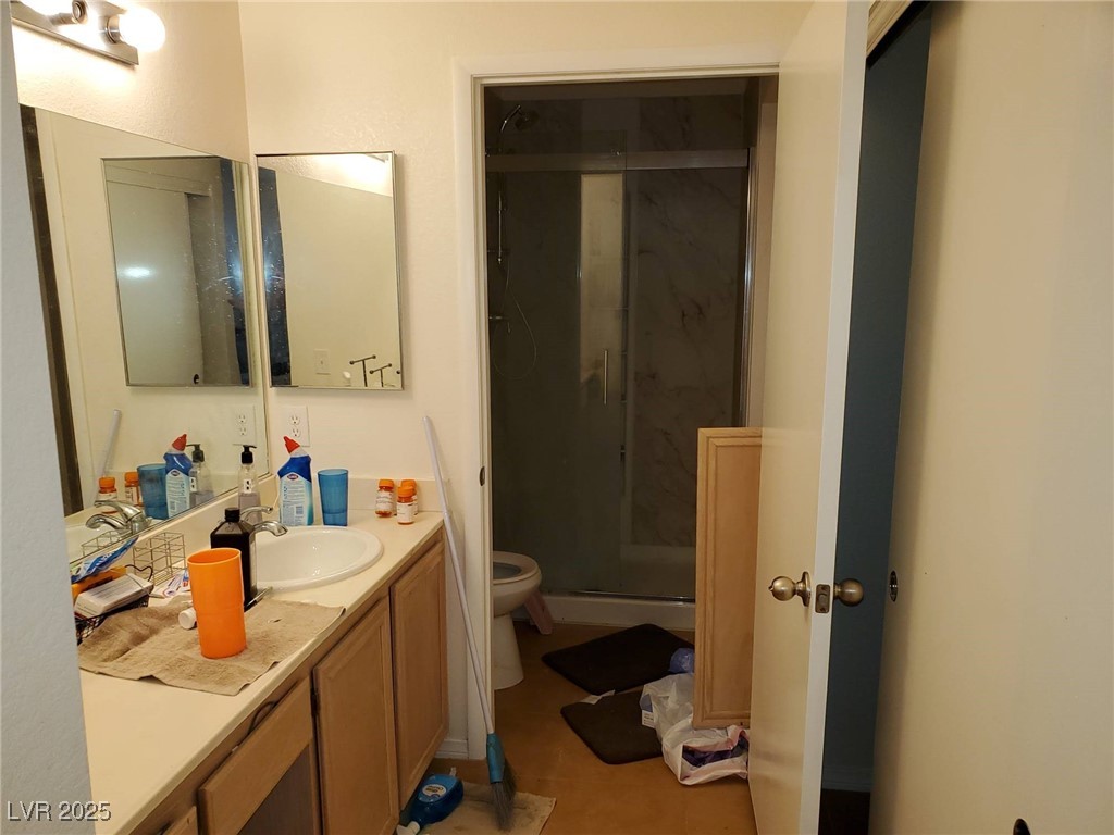 8070 West Russell Road, Unit 1005 Las Vegas, NV 89113 - Photo 3 of 12 Bathroom featuring a marble finish shower, vanity, and light tile patterned floors