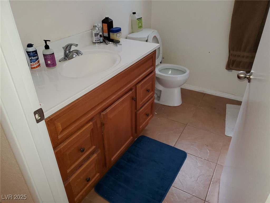 8070 West Russell Road, Unit 1005 Las Vegas, NV 89113 - Photo 9 of 12 Bathroom with light tile patterned flooring and vanity