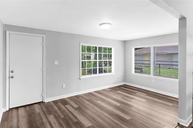 a view of an empty room with a window