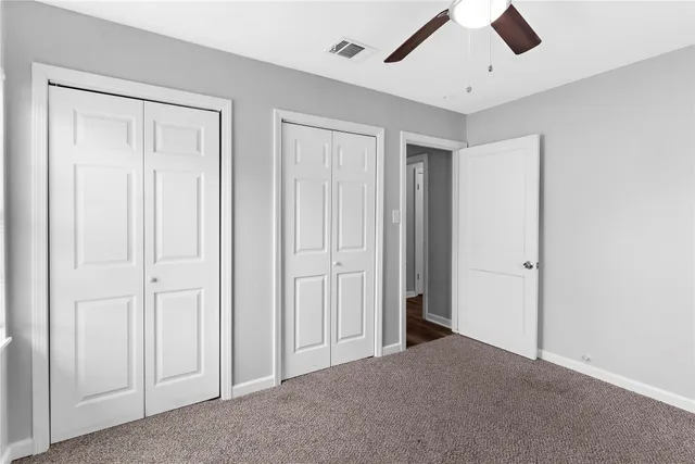 an empty room with closet area