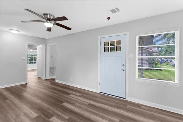 a view of an empty room with a window