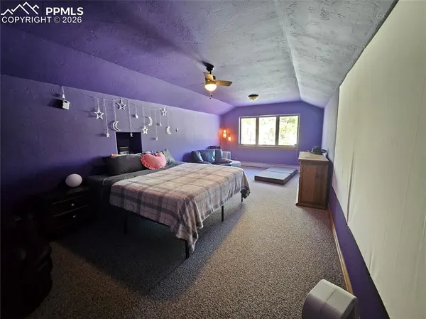 a living room with furniture pool table tennis and a table