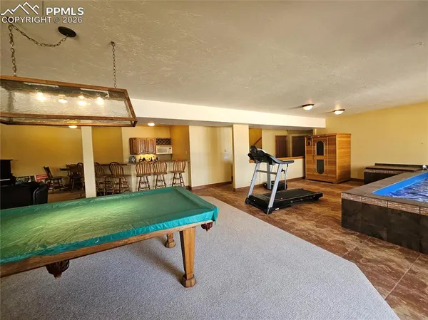 a room with lots of gym equipment