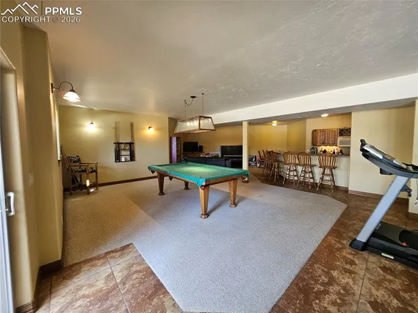 a view of a dining room with furniture and window